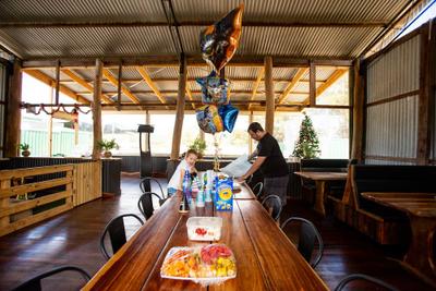 A long table in the hay barn